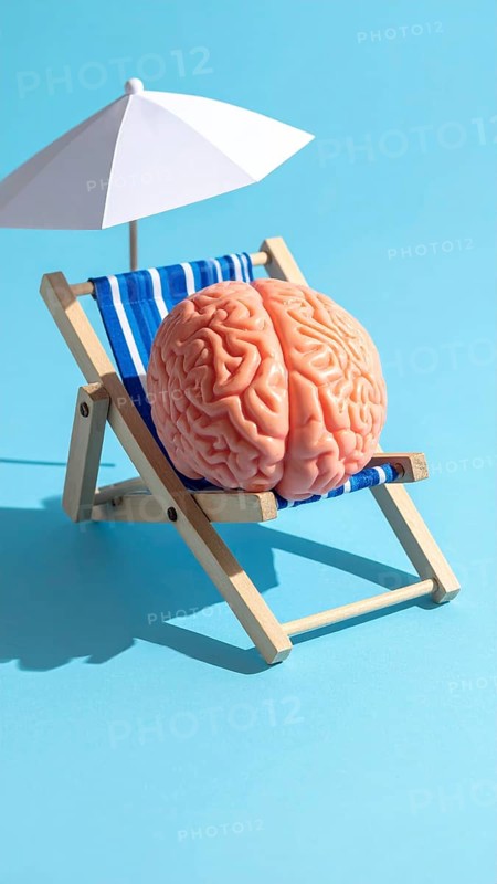 Brain relaxes on a sunbed under the summer sun, placed on a flat surface, symbol for mental health, AI generated