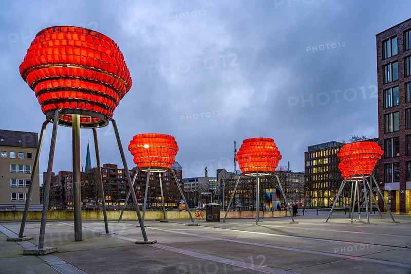 Illuminated sculptures of Dortmund roses in front of Dortmund's landmark U at dusk, Dortmund, North Rhine-Westphalia, Germany
