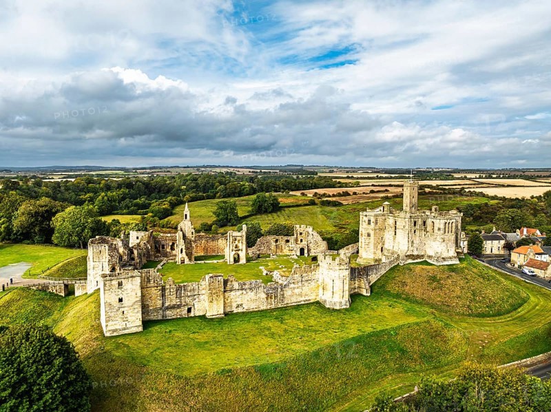 Warkworth Castle over River Coquet from a drone, Warkworth, Northumberland, England, United Kingdom