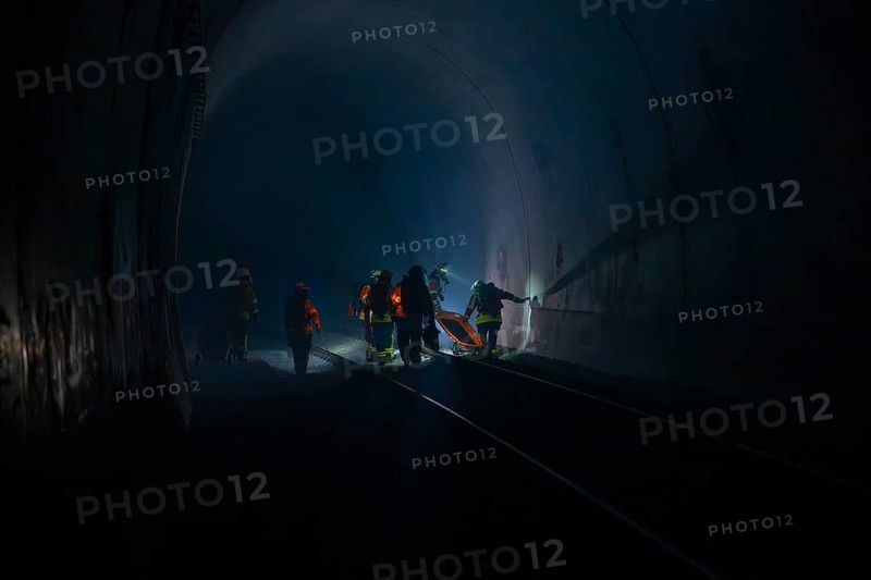 Fire brigade operation in a dark tunnel in dim light, fire brigade exercise in the new construction tunnel of the Hermann Hesse railway, Ostelsheim, Calw district, Germany