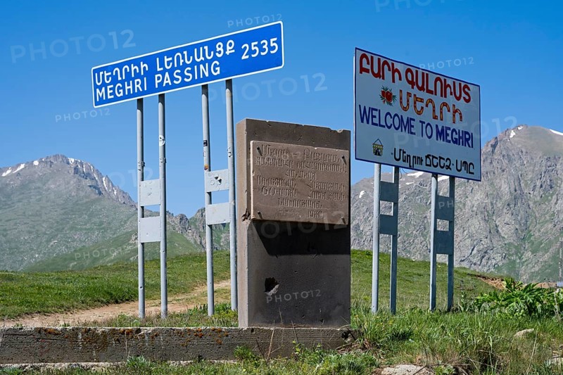 Signs on a roadside indicating the border to a place in a mountainous region, at the highest pass in Armenia, Meghri Pass, Tashtun Pass, Syunik Province, Syunik, Armenia