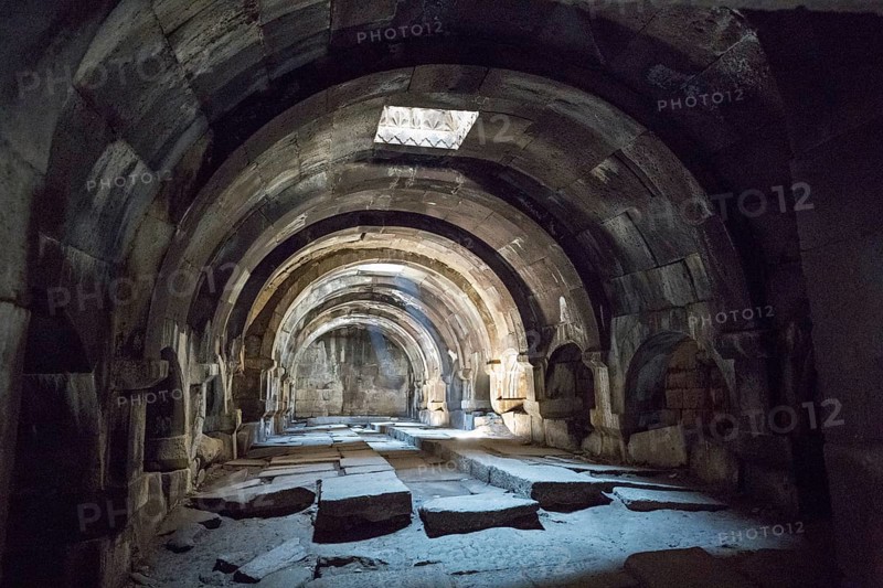 Arched, stone interior structure emphasised by light and shadow, Orbelian's Caravanserai, Selim Caravanserai, located on the Vardenyats Pass or Selim Pass, Vayots Dzor Province, Armenia