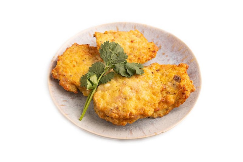 Fried crispy Chicken pancakes isolated on white background. side view, close up