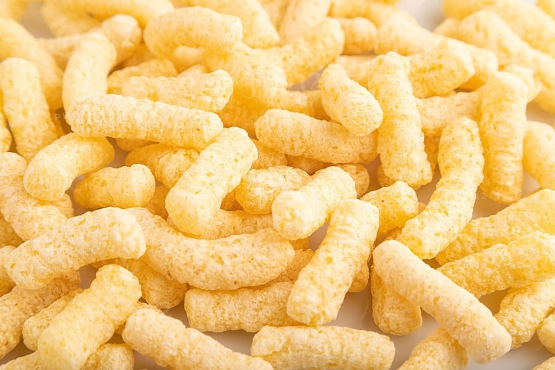 Corn flakes sticks with caramel isolated on white background. top view, flat lay, close up