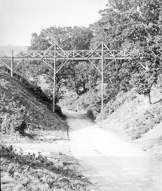 Magic lantern slide of footbridge crossing the road at Wilford Hollows, Bromeswell, Suffolk, England, UK c 1910