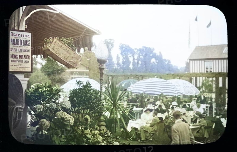 People enjoying pleasure gardens at the Karsino of Fred Karno, Tagg's Island, Molesley, London, England, UK 1920s or 1930s colourised