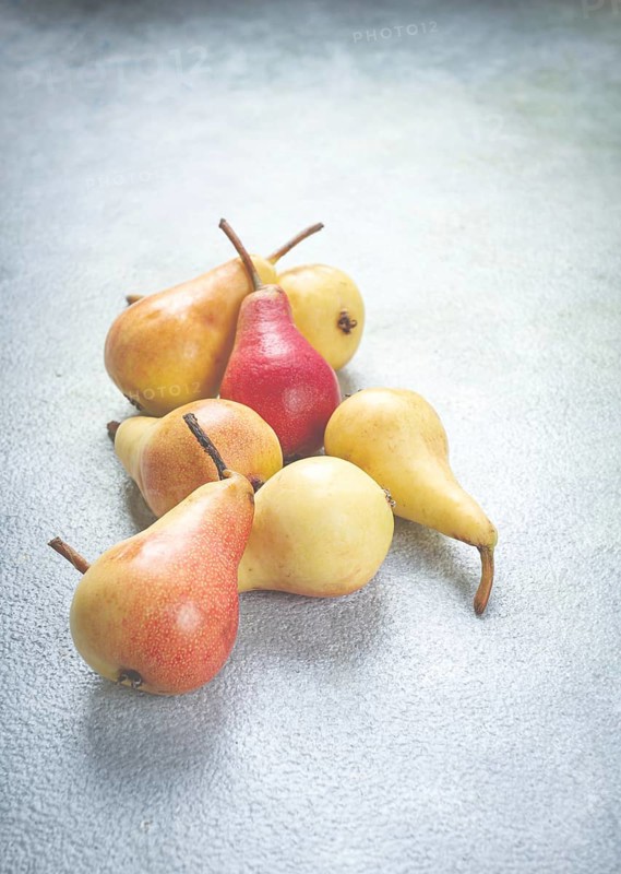 Small pears, Duchess variety, scattered on the table, top view, no people