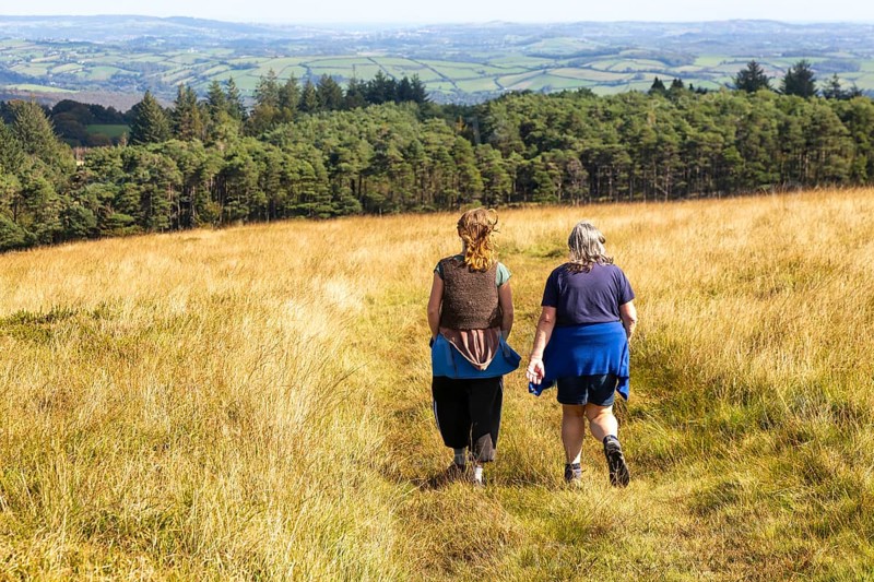 Two women, mother and daughter, walking on moorland in autumn, near Hayford, Buckfastleigh, Dartmoor national park, Devon, England, UK