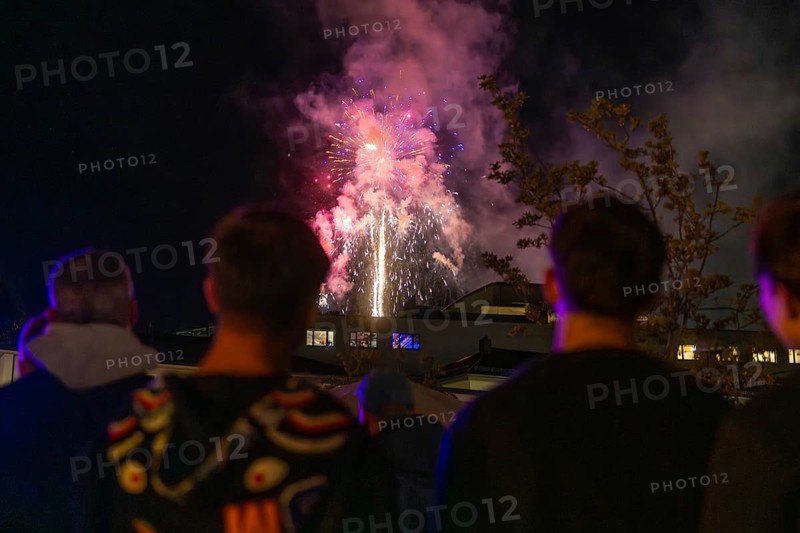 Group of people watching colourful fireworks at night, Fire Night, Sindelfingen, Germany