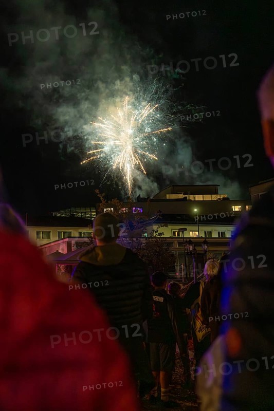 Fireworks light up the night sky while spectators watch in the dark, Fire Night, Sindelfingen, Germany