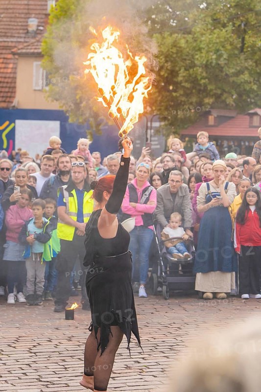 A fire show artist demonstrates her skills in front of a fascinated audience, Feuernacht, Sindelfingen, Germany