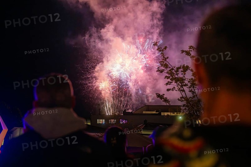 A spectacular firework display unfolds in the night sky while spectators watch, Fire Night, Sindelfingen, Germany