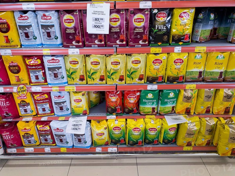 Various tea brands displayed in colourful packaging on a supermarket shelf, tea for sale, Turkey