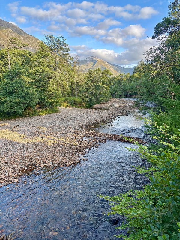 Mountain landscape with a clear flowing river and lush forests, Glen Nevis, Fort William, Scotland, Great Britain