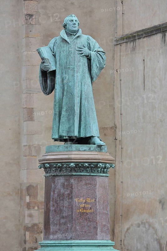 Luther monument, Martin Luther with Bible, sculpture, verdigris inscription, monument, Magdeburg, Saxony-Anhalt, Germany