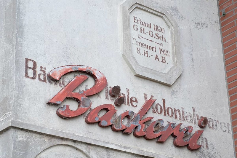 Façade lettering of an old bakery that was applied over even older lettering, Barrien, Syke, Diepholz, Lower Saxony
