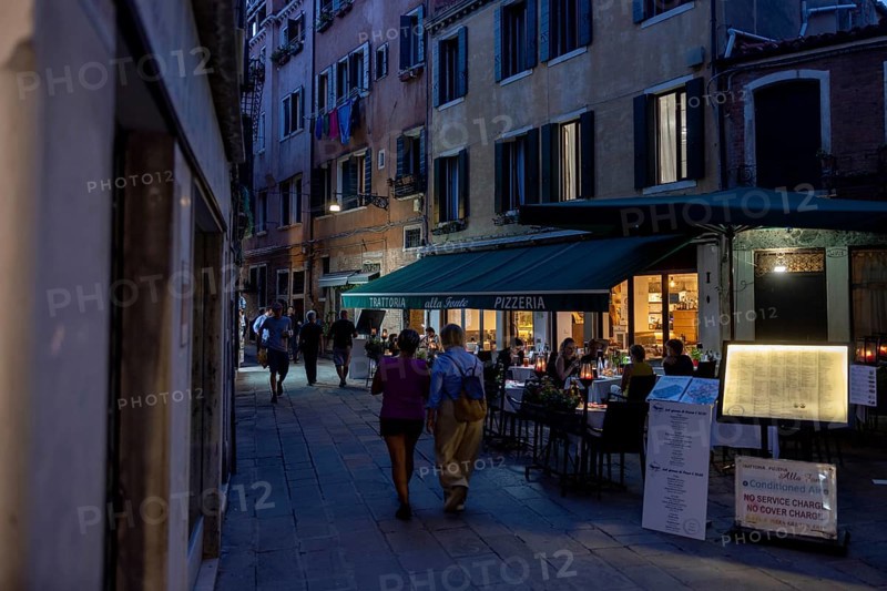 Venice, Italy - 2 September 2025: People stroll in San Marco in Venice at sunset during the 82nd Venice International Film Festival