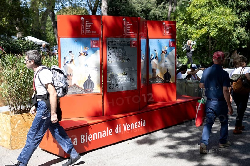Venice, Italy - 3 September 2025: People walk past a billboard advertising the festival during the 82nd Venice International Film Festival