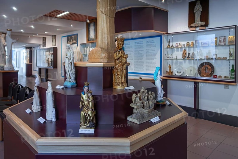 Religious statuettes in museum near Our Lady of Beauraing, Notre-Dame de Beauraing sanctuary, place of pilgrimage at Beauraing, Namur, Belgium