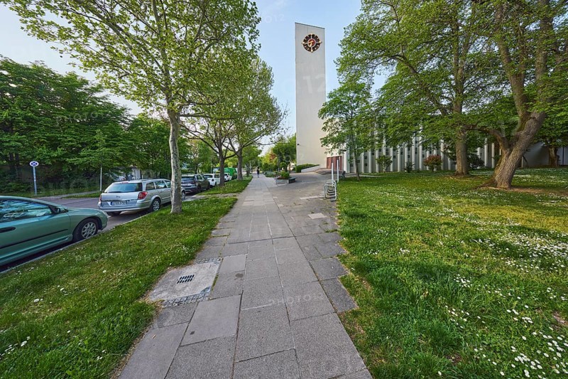 Ev. Stephanuskirche Weilimdorf gable, church, modern architecture, architect Wilhelm Tiedje, church tower, tower clock, pavement, parking lane with vehicles, trees, lawn, evening light, blue sky, cloudless, Giebelstraße, Stuttgart, state capital, city district Stuttgart, Baden-Württemberg, Germany