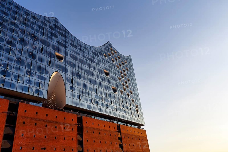 Facade of the Elbphilharmonie with Plaza viewing platform, blue sky, evening light, Hamburg, Germany