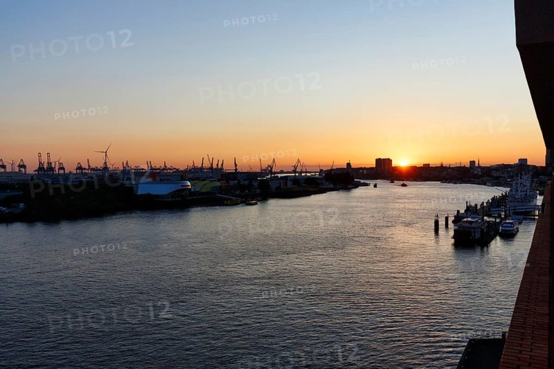 Hamburg harbour, view from the Elbphilharmonie over the Elbe at sunset, cranes of the container port on the horizon, Hamburg, Germany