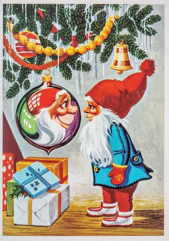 Old Christmas greeting card. Santa Claus is reflected in a Christmas tree decoration