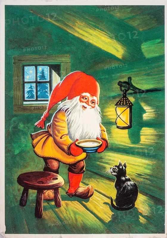 Old Christmas greeting card. Santa Claus gives the cat a bowl of milk
