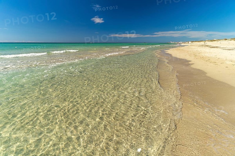 Crystal-clear turquoise water on the beach at Torre San Giovanni, Marina di Ugento, Apulia, Italy