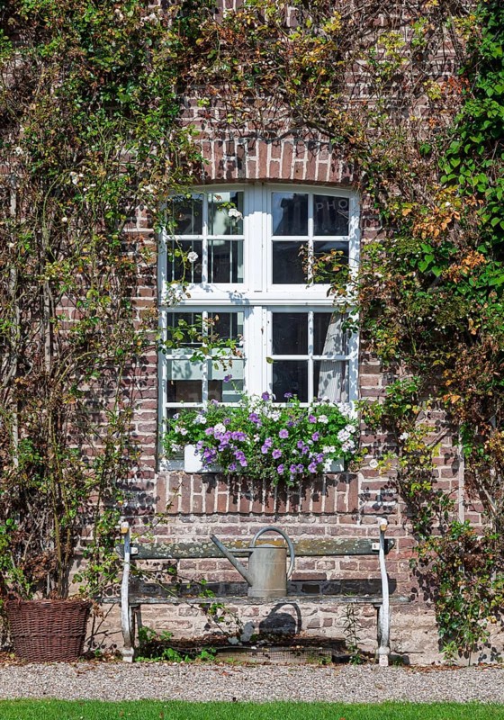 House facade with white window and bench, North Rhine-Westphalia, Germany