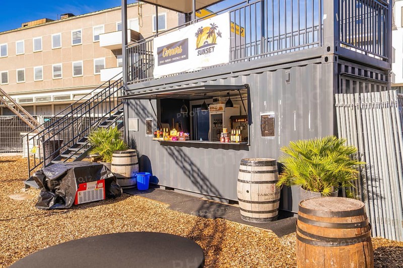 A snack container with barrels and plants outside in the sunshine, open air cinema Sindelfingen, district of böblingen, Germany