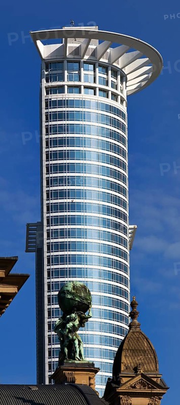 Central station with Atlas carrying the globe on his shoulders in front of the DZ Bank tower block, Frankfurt am Main, Hesse, Germany