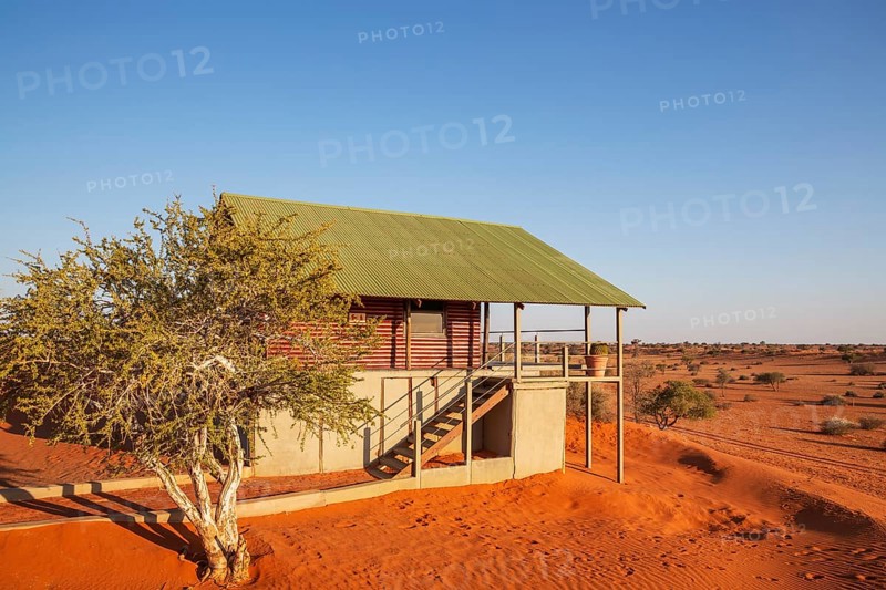 Some of the chalets of the Bagatelle Kalahari Game Ranch are built on top of a sand dune. Kalahari Desert, Namibia