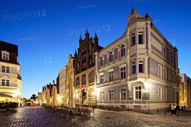 Night view, splendid town houses, building on the right neo-Renaissance, centre gabled house, brick Gothic, in front of it open space, Alter Markt north side, Old Town, UNESCO World Heritage Site, Hanseatic City of Stralsund, Mecklenburg-Western Pomerania, Germany