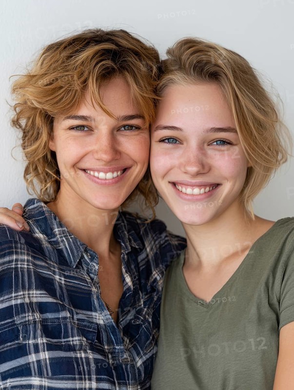 Two smiling woman in casual clothes pose friendly on a wall, symbolic image for same-sex relationship, love, marriage, LGBTQ, AI generated, AI generated