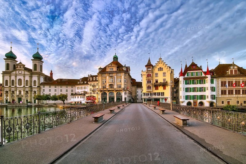 View from the Reuss bridge onto the old town of Lucerne with Jesuit church, decorative cloudy atmosphere, Canton Lucerne, Switzerland