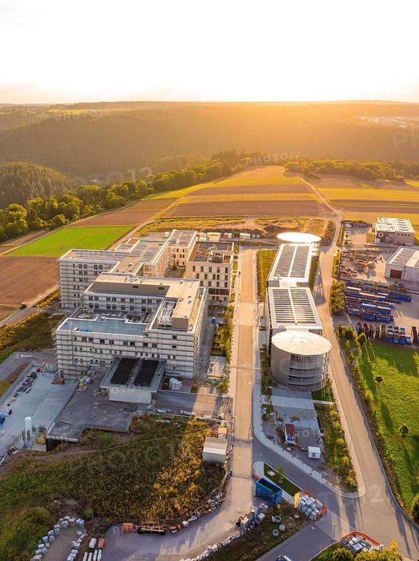 Compact aerial view of a modern building complex at sunset, new hospital building, Calw health campus, Black Forest, Germany