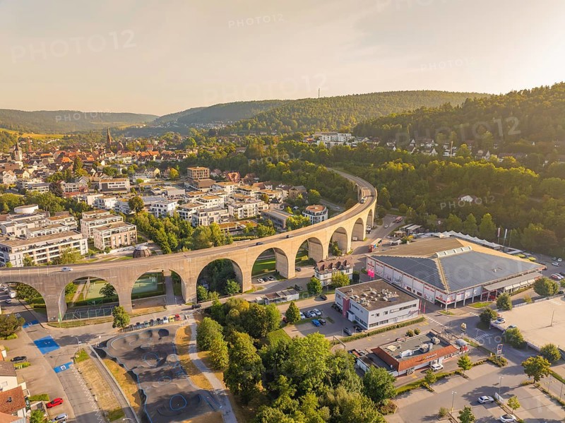 Town view with dominating viaduct running through an urban and natural landscape, small town pearl Nagold, Black Forest, Germany