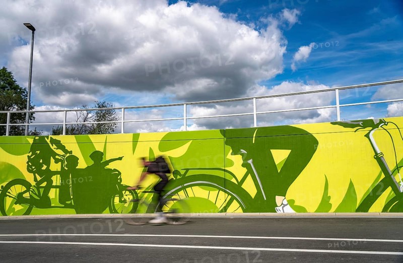 New bicycle tunnel at the junction of the B51 and Warendorfer Straße, in Münster, a bicycle and pedestrian tunnel, 150 metres long, 5.50 metres wide, crosses under the busy roads so that cyclists and pedestrians can pass without crossing, route to and from Münster city centre, visually designed with local motifs as murals, by Lackaffen.de, modern bicycle infrastructure, North Rhine-Westphalia, Germany
