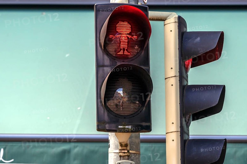 Pumuckel figure in a pedestrian traffic light, Munich, Bavaria, Germany