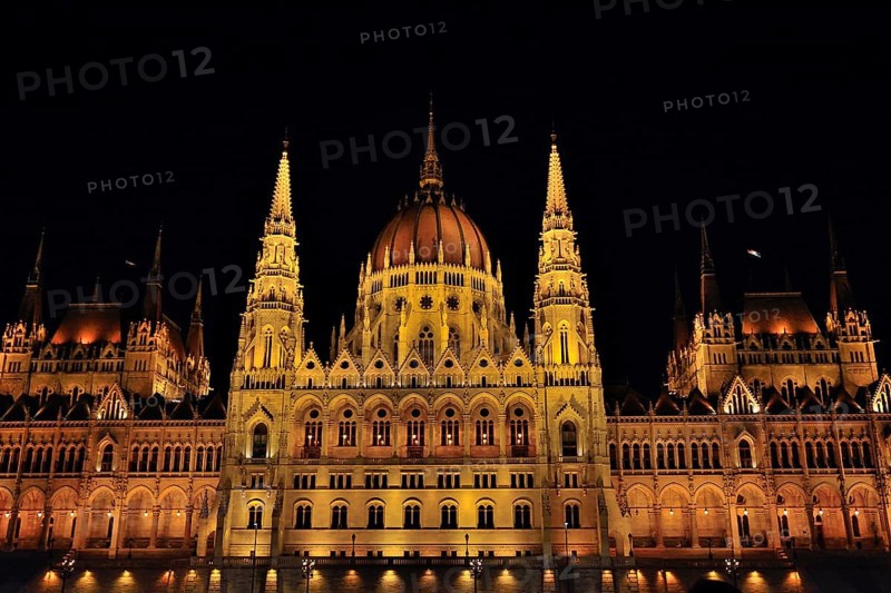 Majestic hungarian parliament building glowing at night, showcasing its stunning architecture and reflecting in the danube river