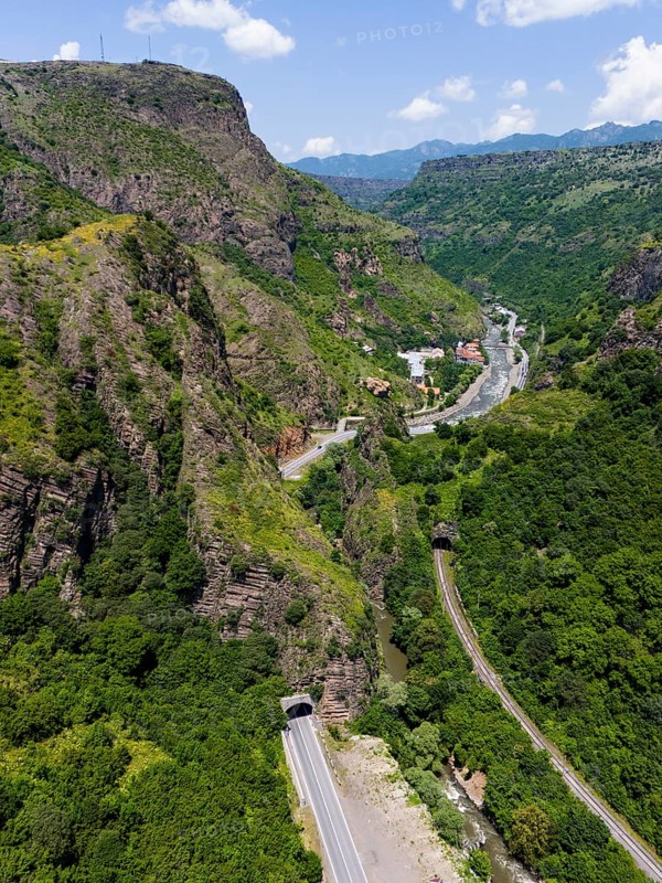 Landscape with road and tunnel between forested mountains and river, aerial view, landscape near Dzoraget, river Pambak in front of the tunnel, river Debed, gorge Debed, Lorikeet province, Armenia