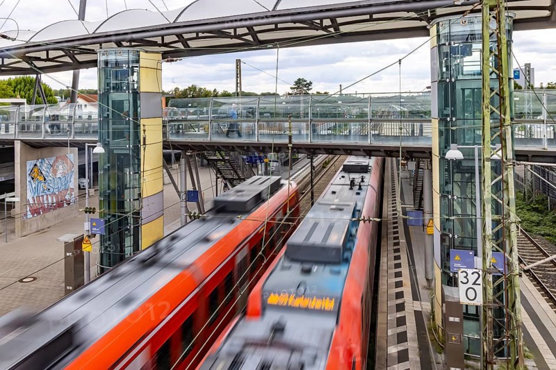 Railway station with passing S-Bahn in Walldorf-Wiesloch. Wiesloch, Baden-Württemberg, Germany
