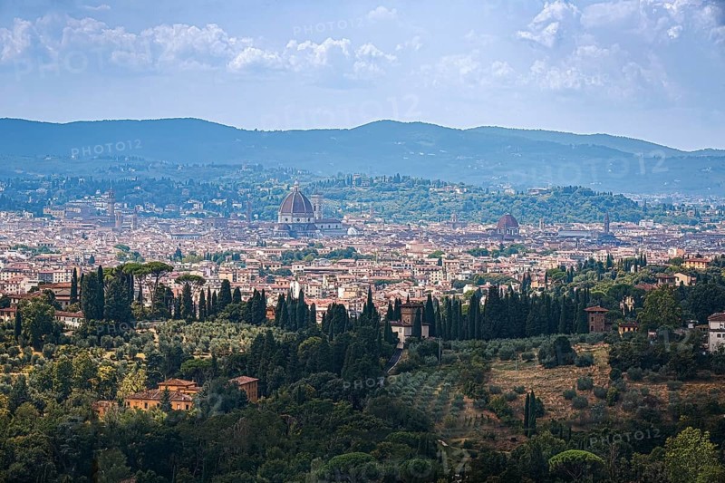 Sweeping views of the city of Florence and cathedral surrounded by Tuscan hills in Italy