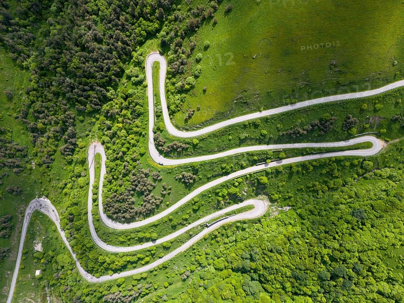 Serpentine road winding through green hills and forests, aerial view, road H52 above a tunnel, Dilijan, Dilijan, Delijan, Delijan, Dilijan National Park, Tavush Province, Tavush, Tavush, Armenia