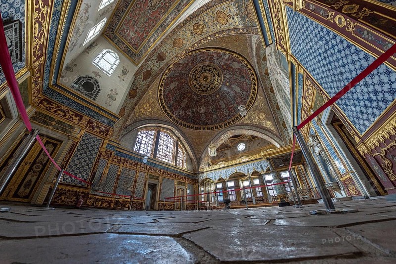 Wide angle view of the richly decorated interior of topkapi palace, showcasing intricate ottoman architecture and design