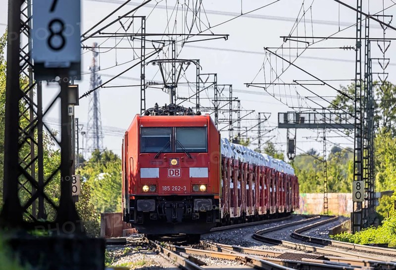 Car train with new cars on the railway line near Stuttgart. The so-called Schusterbahn is a bypass of Stuttgart main station and is mainly used by goods trains. Stuttgart, Baden-Württemberg, Germany