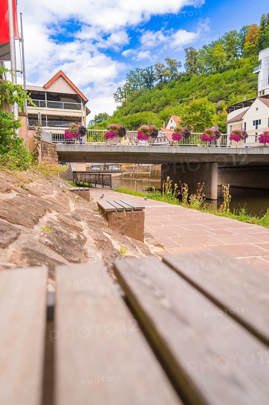 Small town bridge decorated with summer flowers in an urban setting, small town pearl Calw, Black Forest, Germany