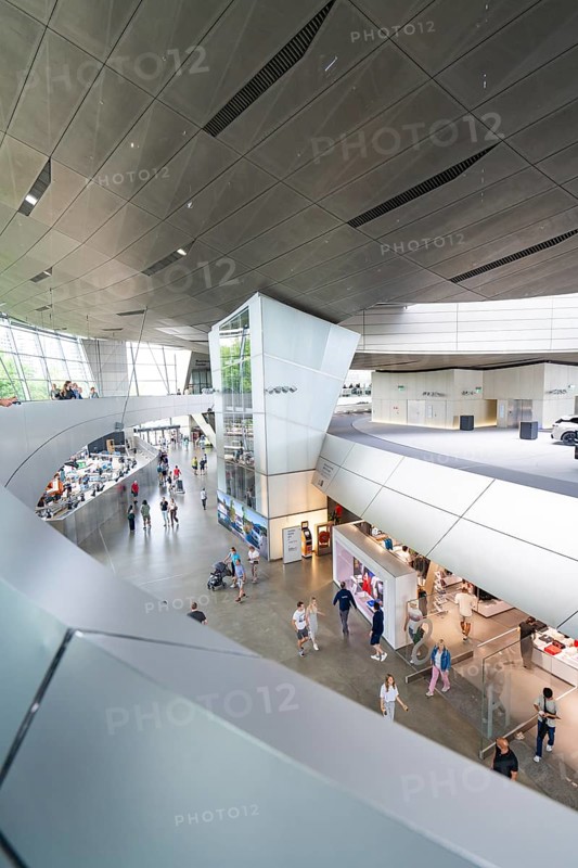 Modern building complex with various shops and numerous visitors, BMW Welt, Munich, Germany