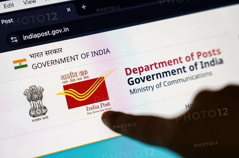 New Delhi, India – August 23, 2025: In this photo illustration, the India Post logo is seen on a digital display. The Indian Department of Posts has announced a temporary suspension of most postal services to the United States from Aug 25